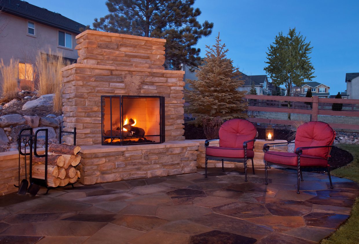 Picture of a fireplace made out of stones.