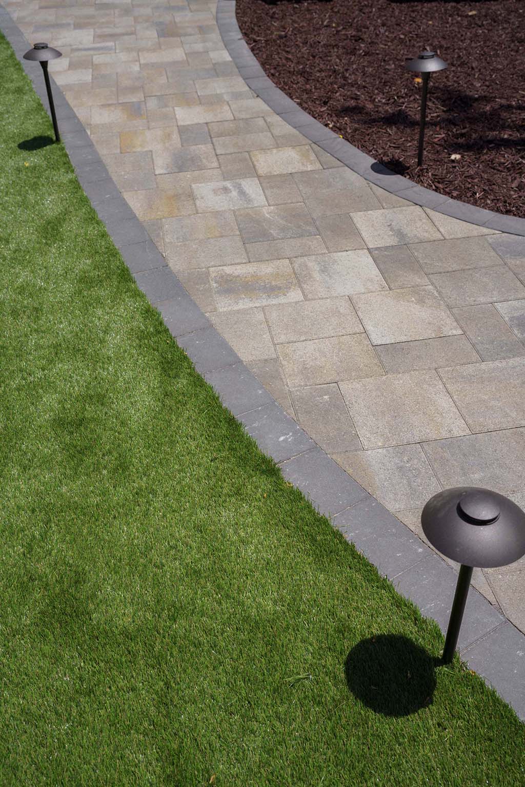 Photo of brown pavers with grey border
