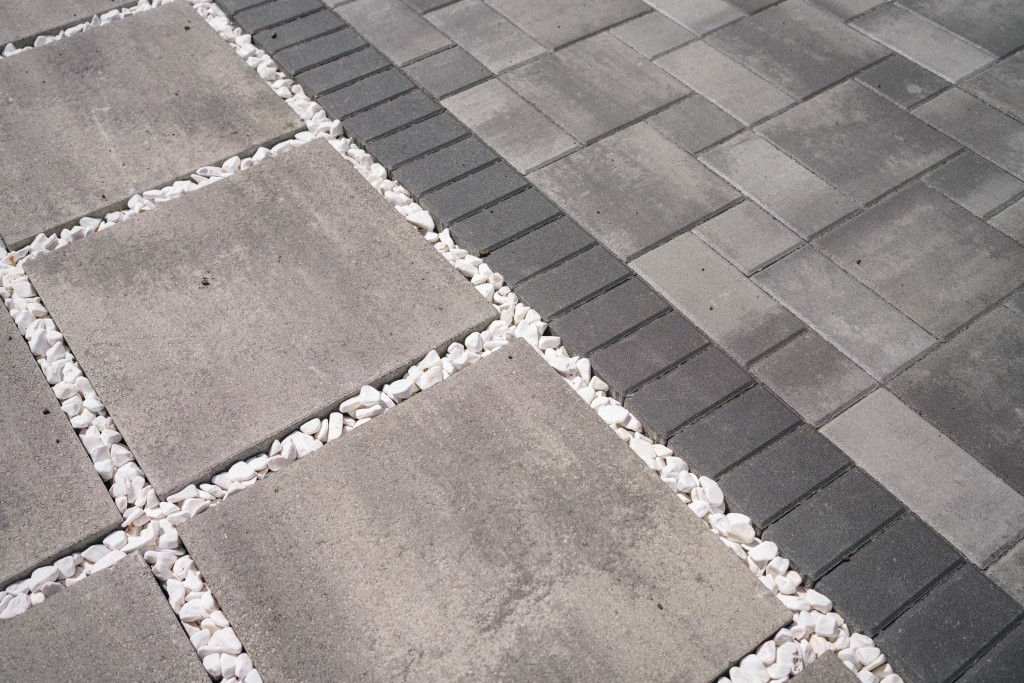 Photo of grey pavers with black border