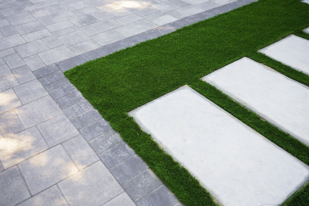 Photo showing light gray pavers with dark grey border