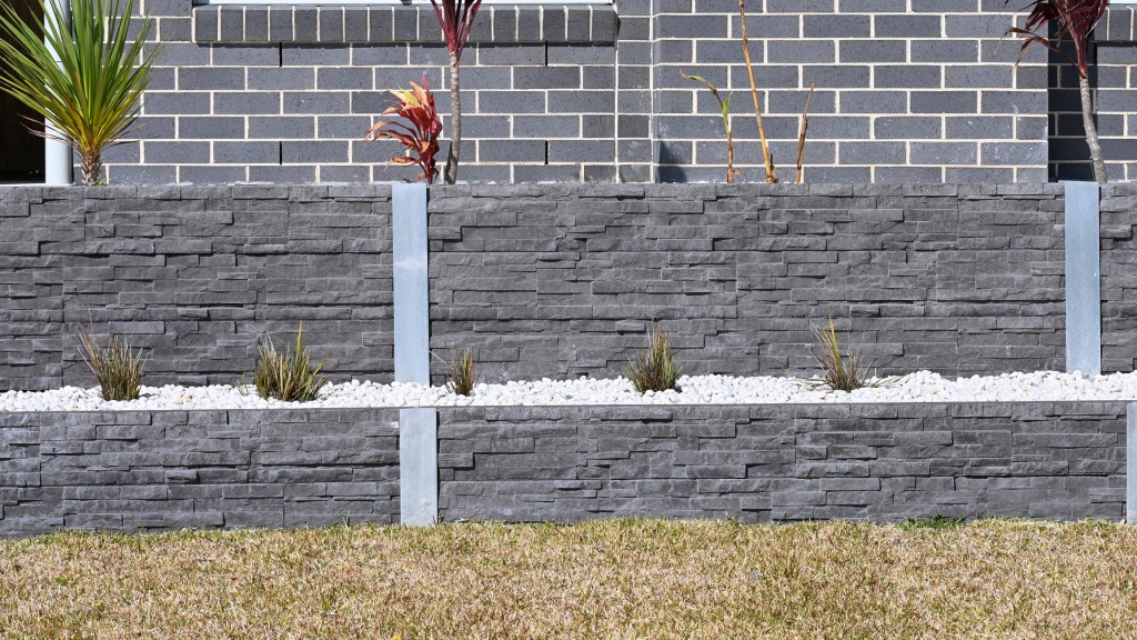Photo of retaining wall made of cinder blocks and veneer applied