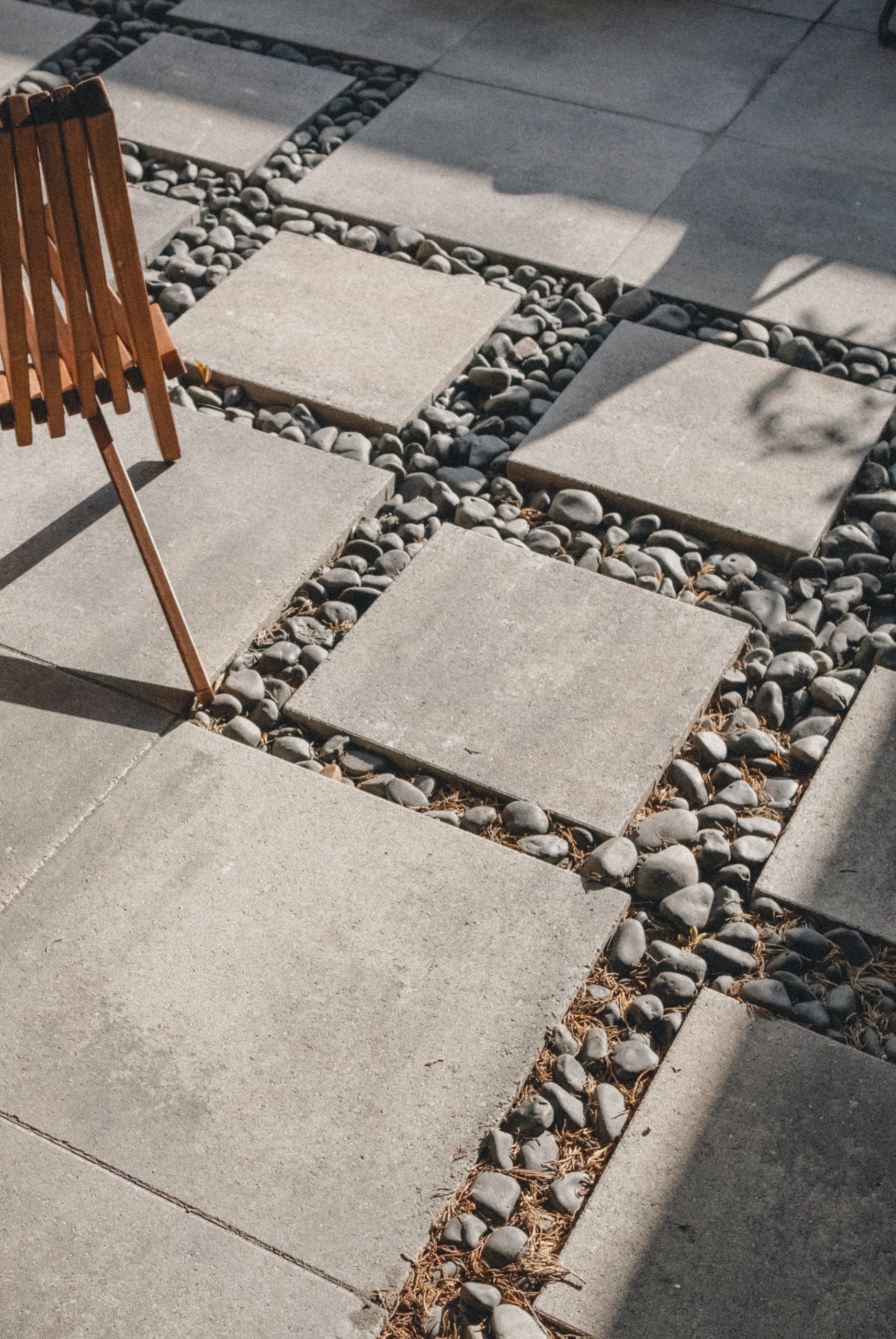 Photo of gray pavers with gray pebbles interlaying
